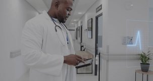 Animation of data processing over african american male doctor in hospital. Global medicine, computing and data processing concept digitally generated video.
