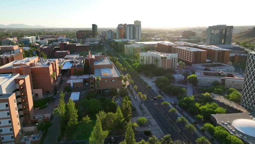 ASU campus during sunset. Aerial establishing shot of Arizona State University academic buildings and beautiful grounds.