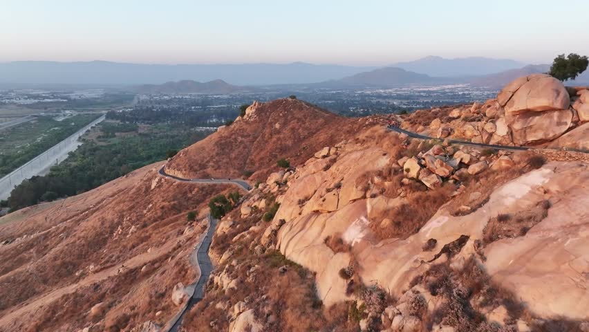 mt rubidoux in riverside california at sunset with people hiking in view