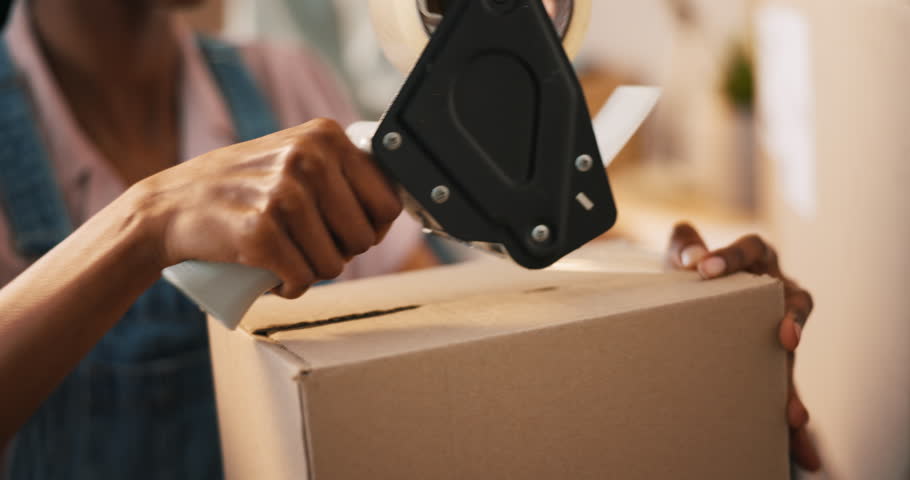 Packing, cardboard box and order with delivery and package label for small business. Hands, person and shipping courier for ecommerce and online purchase with a entrepreneur working on store shipment