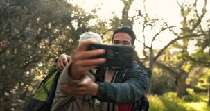 Video call, happy and hiking with couple in nature for communication, social media and live streaming. Adventure, trekking and travel with portrait of man and woman in forest for network and contact