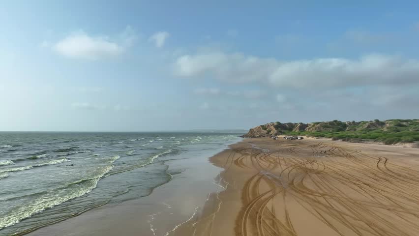 Panoramic aerial view of Gadani beach landscape, People gathered at Gadani beach for a drifting race alongside the Arabian Sea, Balochistan, Pakistan