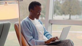Happy African Black girl student studying in university using laptop, school girl sitting in chair in college campus elearning, studying, hybrid learning or working online, doing ecommerce shopping. - Powered by Shutterstock - Get 15% off with code: PIKWIZARD15