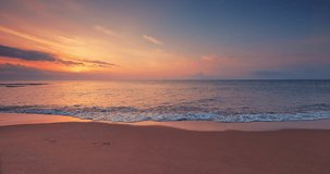 Tropical sea sunrise over beach shore with gentle rolling waves on the sand 4K video