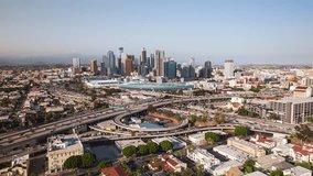 Establishing Aerial View Shot of Los Angeles LA CA, L.A. California US, day, downtown la, busy freeway, track in