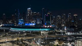 Establishing Aerial View Shot of Los Angeles at night evening, LA CA, L.A. California US, Downtown LA, DTLA, dark, blue hour, busy freeway, traffic, circling left