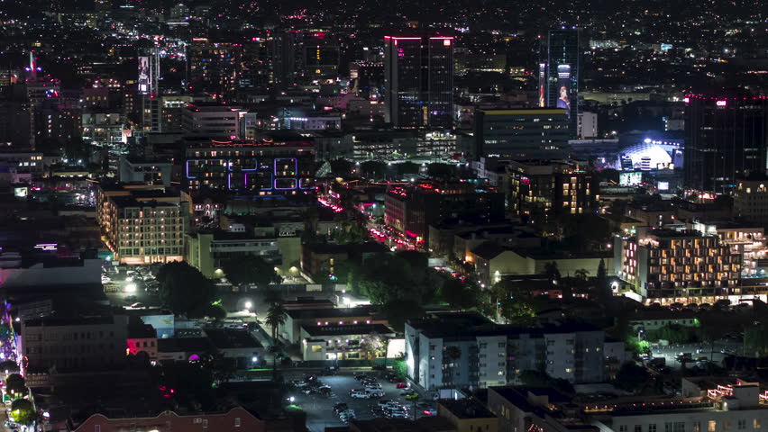 Establishing Aerial View Shot of Los Angeles at night evening, LA CA, L.A. California US, super clear and sharp, circling left, West Hollywood, looking down