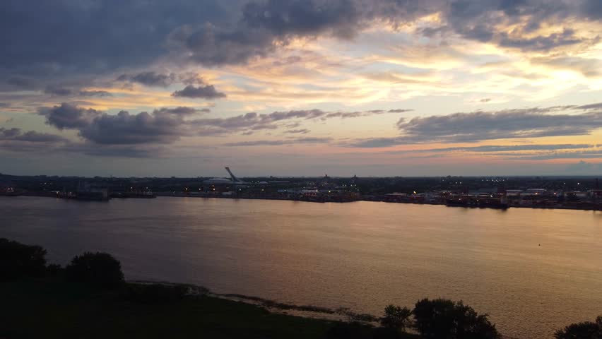 Cloudy Skies At Sunset Over St. Lawrence River In Montreal, Quebec, Canada. wide
