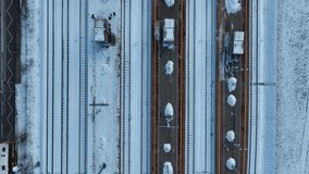 Old railway station covered with snow.
Video footage of train station seen from above.
