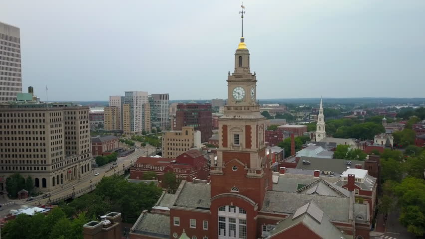 Aerial Slow Motion Shot Of Clock Tower And Buildings Against Sky In City, Drone Flying Over Cityscape - Boston, Massachusetts