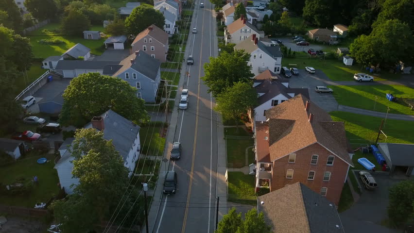 Aerial Forward Shot Of Vehicles On Street Amidst Residential Buildings In City - Boston, Massachusetts