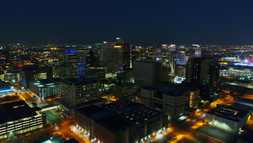Aerial Forward Shot Of Illuminated Towers In City Against Sky At Night, Drone Flying Over Cityscape - Phoenix, Arizona