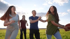 teenagers playing rugby in the park. group of teenagers play american football run outdoors in the park in summer. happy family kid dream concept. family teen play american lifestyle football run - Powered by Shutterstock - Get 15% off with code: PIKWIZARD15