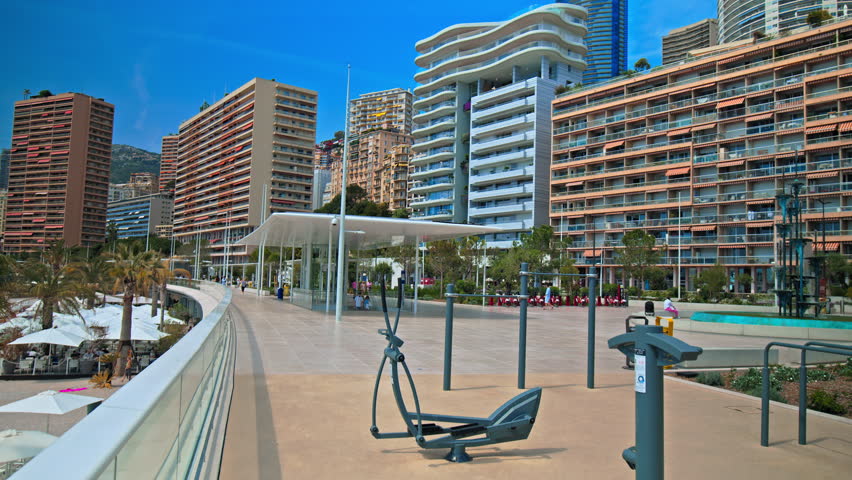 Beautiful new modern residential area in Monaco. Skyscrapers buildings with beach views, tall glass window luxury houses in Monaco, French Riviera.