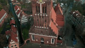 Aerial view of the Antique Saint Catherine's Church with Historical Architecture on the Background. Drone View of the Beautiful District in Poland. Tourism in europe Concept