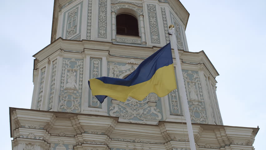 The Ukrainian yellow-blue flag against the background of St. Sophia