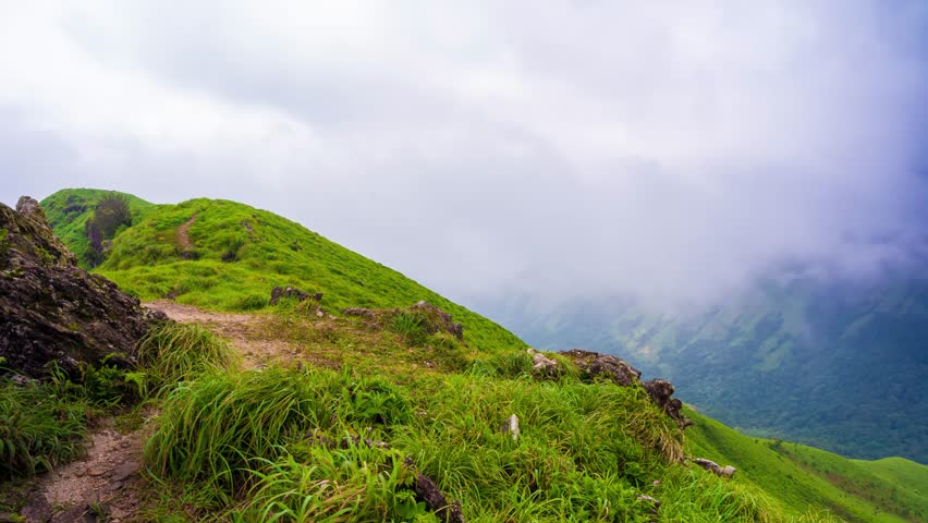 4K Time lapse of clouds over mountains. Devaramane trek Mudigere, India.