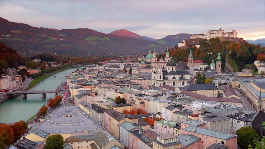Time lapse clip. Sunset in Salzburg, Old City, birthplace of famed composer Mozart. Fantastic autumn scene of Eastern Alps. Splendid  landscape with Salzach river. Full HD video (High Definition).