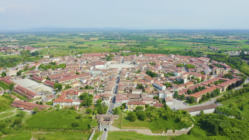 Inscription on video. Palmanova, Udine, Italy. An exemplary fortification project of its time was laid down in 1593. Blue lights form luminous. Electric style, Aerial View
