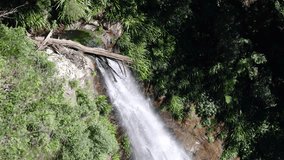 Slow motion video of the Coomera Falls waterfall in the natural background of Coomera, QLD, Australia.