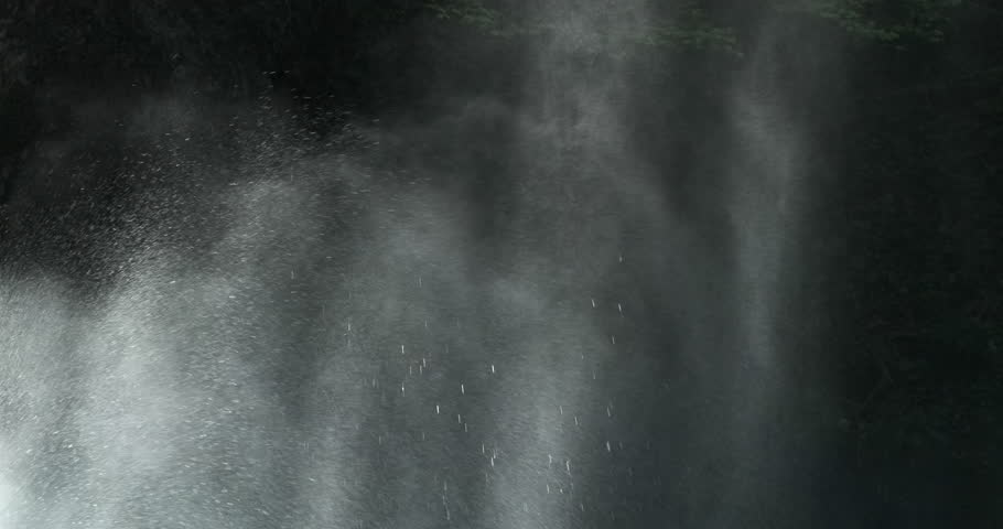 Close up, waterfall water splash on dark nature background. Water drops scatter from mountain waterfall splash in morning sunlight. Powerful water splash, closeup. Fresh splashing water. 4k abstract  Royalty-Free Stock Footage #1107520881