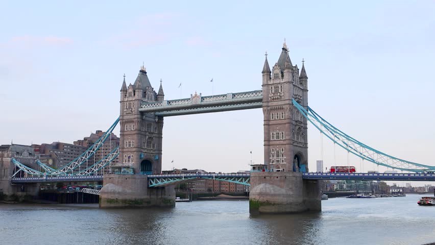 The Tower Bridge at sunset, a Grade I listed combined bascule and suspension bridge in London that crosses the River Thames close to the Tower of London Royalty-Free Stock Footage #1107521855