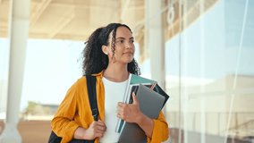 Woman university student. Happy lovely brazilian or hispanic female student, with a backpack, hold books and notebooks in her hand, walk near the university campus, looks and smile to the side - Powered by Shutterstock - Get 15% off with code: PIKWIZARD15