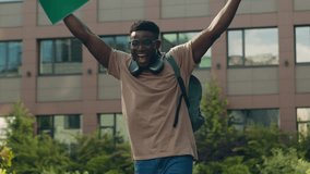 African American happy success winner student guy university education learning college test exam good result man ethnic male in city outdoors win victory studying achieve achievement rejoice champion - Powered by Shutterstock - Get 15% off with code: PIKWIZARD15