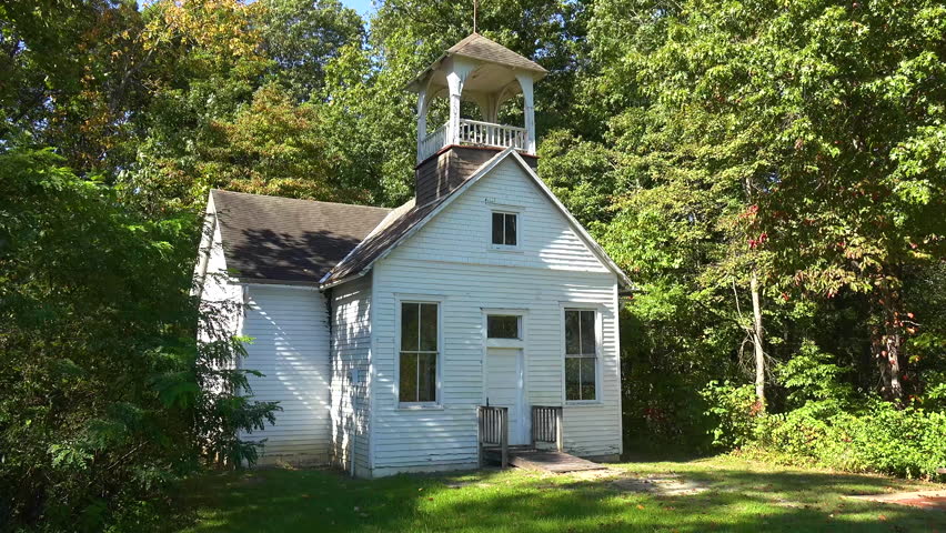 Kentucky - 2023 - establishing shot of a one room schoolhouse in the countryside.