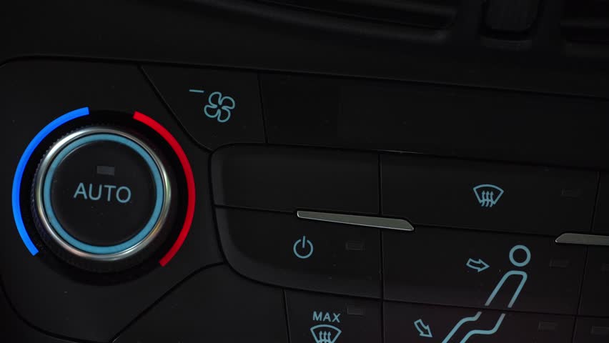 Finger turning on toggle switch of car air conditioner and switching on the windshield defrost mode, two-phase climate control in the car Royalty-Free Stock Footage #1107531815