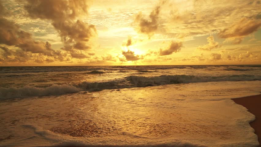 Beautiful sea sunrise or sunset sky over sea.Amazing sky and shining golden waves landscape,Beautiful waves crashing on sandy shore,Beach Sea sky nature background