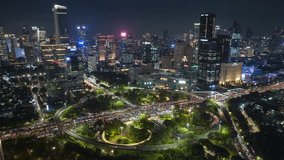 night illuminated jakarta city downtown famous traffic street road interchange aerial panorama 4k timelapse indonesia - Powered by Shutterstock - Get 15% off with code: PIKWIZARD15