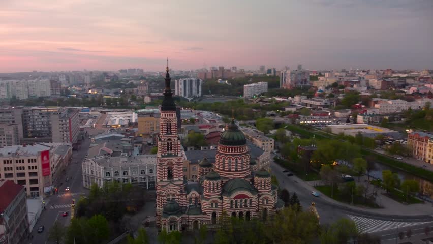 Arc footage with Holy Annunciation Cathedral and evening sunset scenic cloudscape. Aerial view Kharkiv city orthodox church in downtown, Ukraine