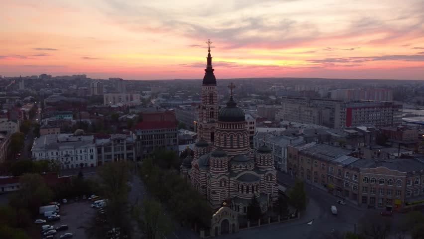 Scenic sunset above Holy Annunciation Cathedral with evening cloudscape. Aerial view Kharkiv city orthodox church in downtown, Ukraine