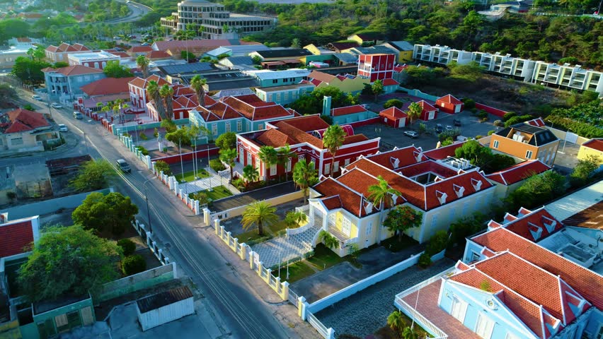 Homes and official buildings in Willemstad curacao illuminated by sunrise golden hour Royalty-Free Stock Footage #1107557199
