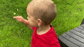 wet toddler child playing in the garden near apple tree in summer rain - Powered by Shutterstock - Get 15% off with code: PIKWIZARD15
