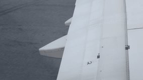 view through airplane window to the wing while aircraft running for take off from runway in international airport ready to travel ,aviation plane operation process background - Powered by Shutterstock - Get 15% off with code: PIKWIZARD15