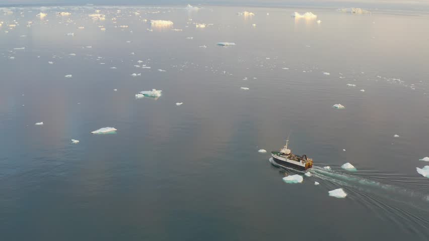 A small boat among icebergs in Greenland
Tourists take pictures of the iceberg. Source of icebergs is by the Jakobshavn glacier. The phenomenon of global warming and catastrophic thawing of ice, Disko