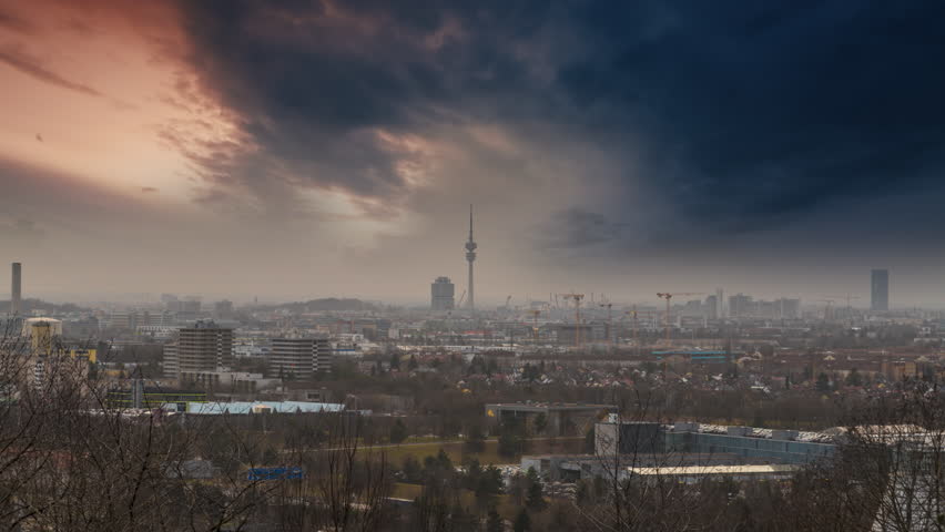 Munich skyline aerial birds view time lapse from day to night, Muich germany panoramic cityscapeview view of city centre downtown skyscrapers munchen city. Royalty-Free Stock Footage #1107568577
