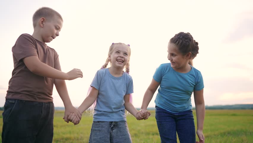 group of children smiling hugging laughing in park. happy family kid dream concept. children boy girl hugging friends laughing having fun outdoors lifestyle faces portrait in the park Royalty-Free Stock Footage #1107572951