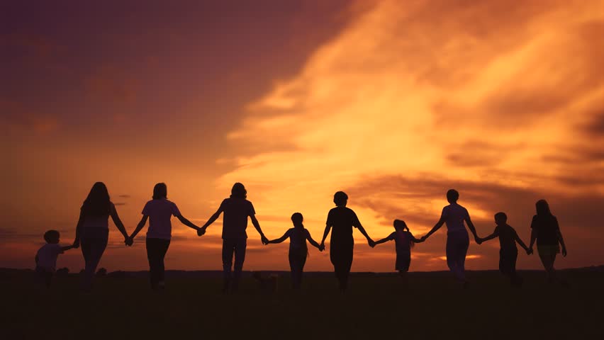 community big family walk in park. a big group of people holding hands walking silhouette on nature sunset in the park. big family kid dream concept. people in the park lifestyle. large family Royalty-Free Stock Footage #1107572953