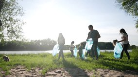 group of volunteers clean up trash. environmental protection ecology cleaning from garbage plastic concept. group world people volunteers collects plastic bottles garbage in bags silhouette - Powered by Shutterstock - Get 15% off with code: PIKWIZARD15
