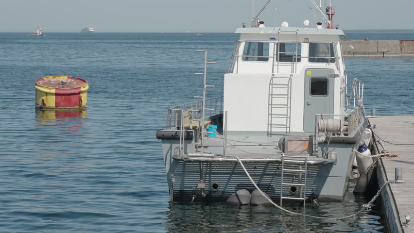 One of the boats docking on the side of the port on a hot summer day in Estonia