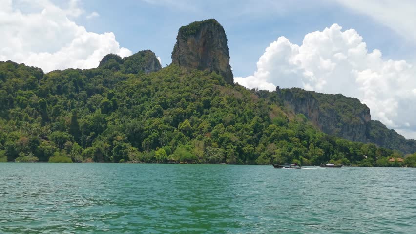 Scenic View Departing Railay Beach with Mountainous Limestone Rocks Along the Coastline of Krabi, Thailand.