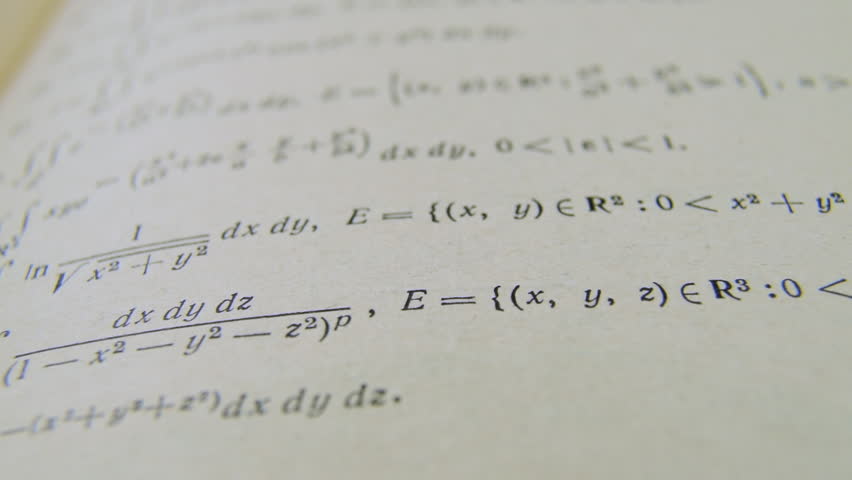 Formulas mathematic formulae equations on paper integral book. Mathematical equations tasks formulas printed on old paper camera slide. Studying.