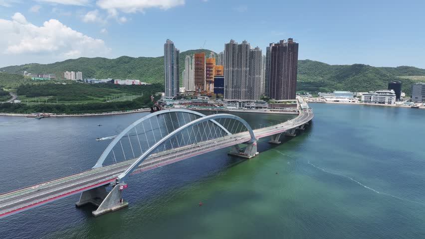 A Commercial and residential community development construction project in Lohas Park Tseung Kwan O Tiu Keng Leng Kowloon Kai Tak Hong Kong , Aerial Drone Top skyview Royalty-Free Stock Footage #1107592439