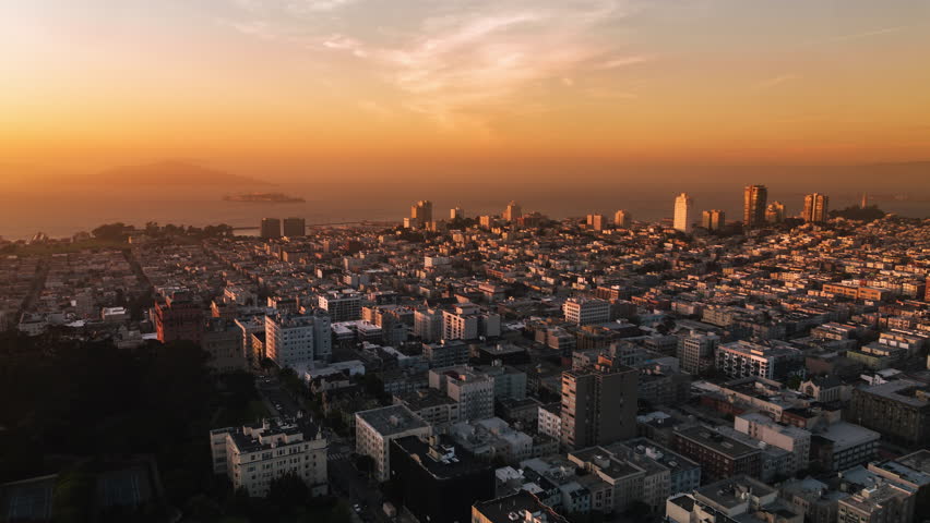 Establishing Aerial View Shot of San Francisco CA, California, United States, America, magical sunset, orange, tracking in push in, North Beach, Alcatraz Island Prison, Fisherman's Wharf