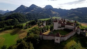 Switzerland travel and landmarks. scenic medieval village and castle Gruyere. canton Fribourg. Aerial drone video