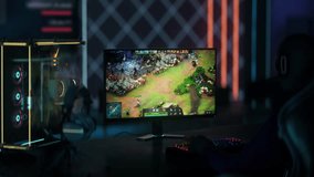 Streamer Achieves Victory By Slaying Powerful Enemy Team Player In MOBA Video Game. Streamer Wins Internet Video Game Match. Streamer Pressing Buttons On RGB Keyboard To Play Video Game. Entertainment