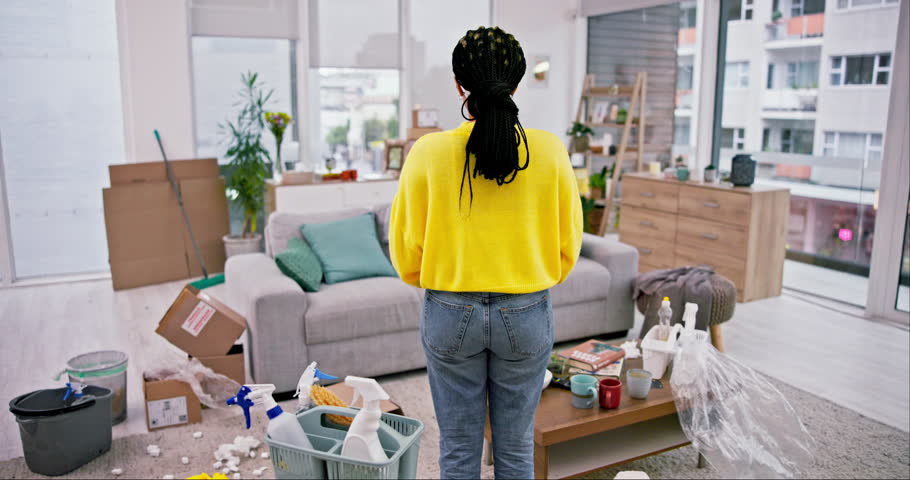 Cleaning, woman and back with messy living room and lounge at home with maintenance. Worker, house and maid frustrated and tired from housekeeping chaos with care with female cleaner and service